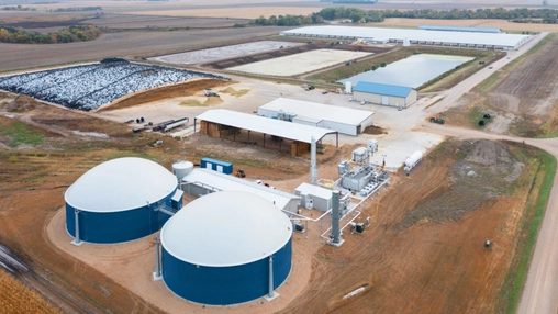 Aerial view of a renewable natural gas plant with anaerobic digesters