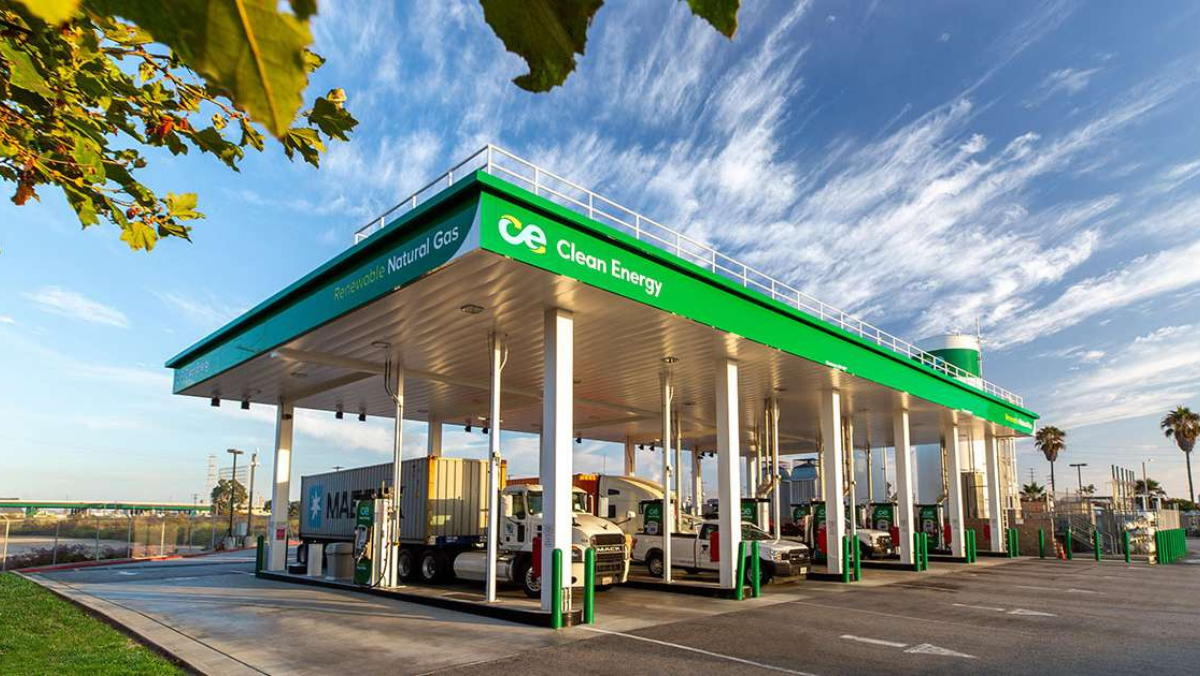 Clean Energy renewable natural gas station with trucks refueling under green canopy